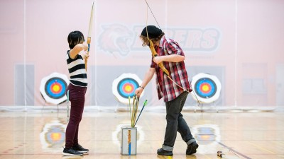Two archers shooting targets