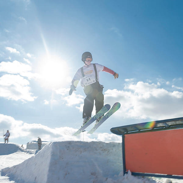 a skier jumping a slope