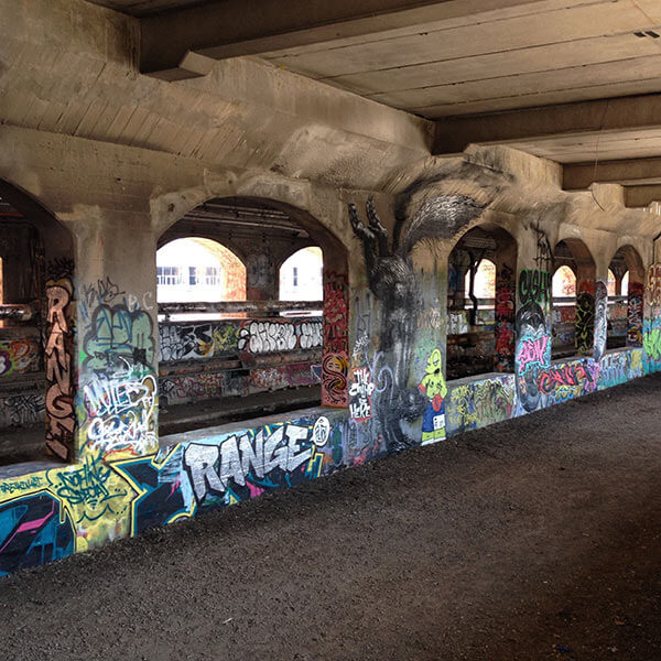 The graffitied walls of the abandoned subway tunnels in downtown Rochester