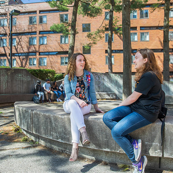 Two people sitting on a bench