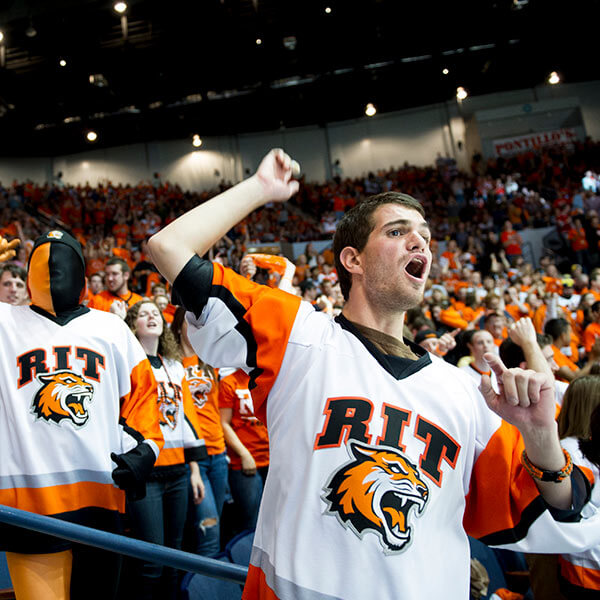 RIT Students in the corner crew cheering on the RIT hockey team