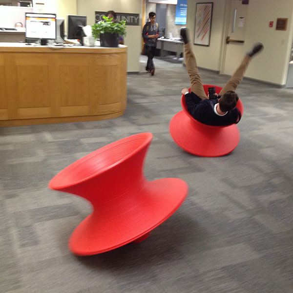 Rolling red chairs in the Wallace Library
