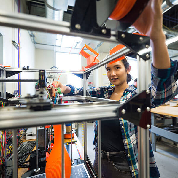 RIT student using a 3D printer
