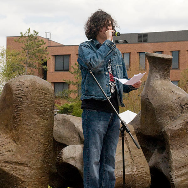 An RIT student reciting their poem at a poetry slam