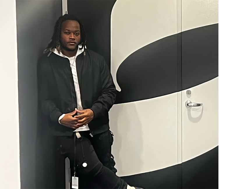 Student standing by doorway of internship