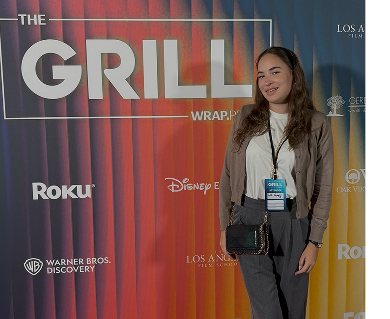 Lea Sevelj in front of colorful screen in L.A.