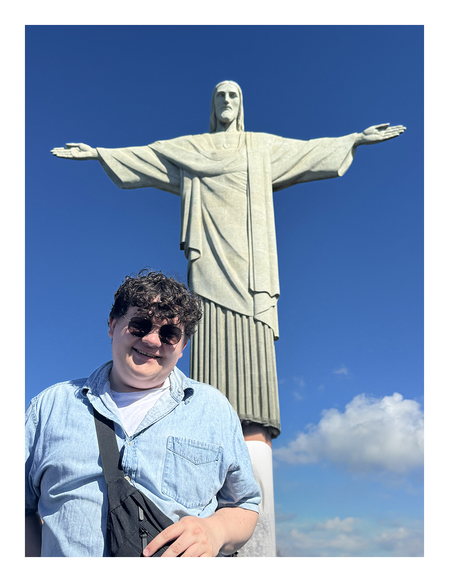 Noah Gill in front of Christ the Redeemer Statue in Brazil