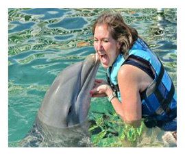 Susan McGroarty with Dolphin in Caribbean