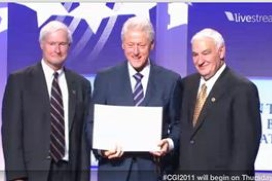 President clinton posing with professors