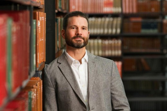 Person posing for camera in library