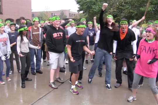 People gathered with green bandanas 