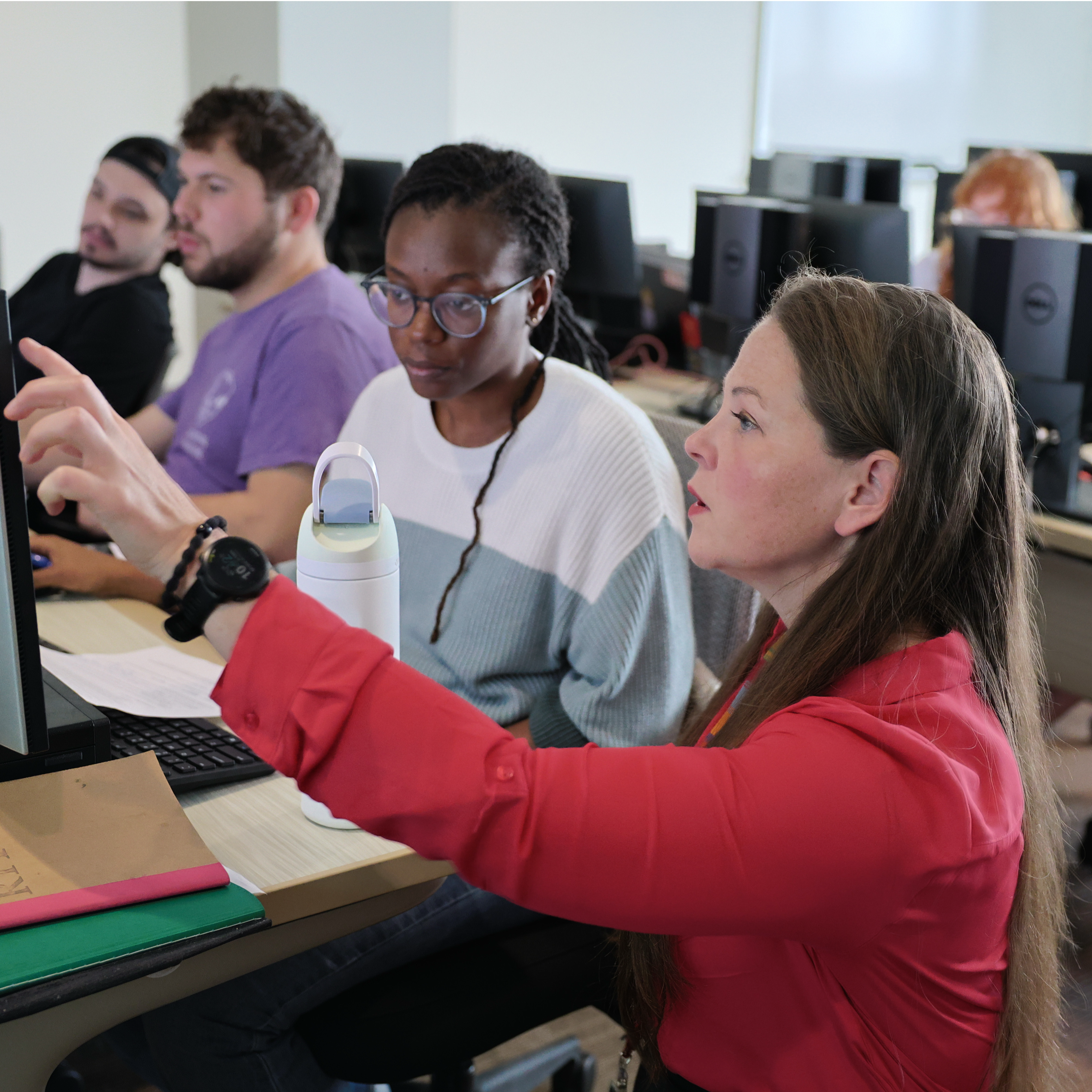 Professor Callie Babbitt working with students
