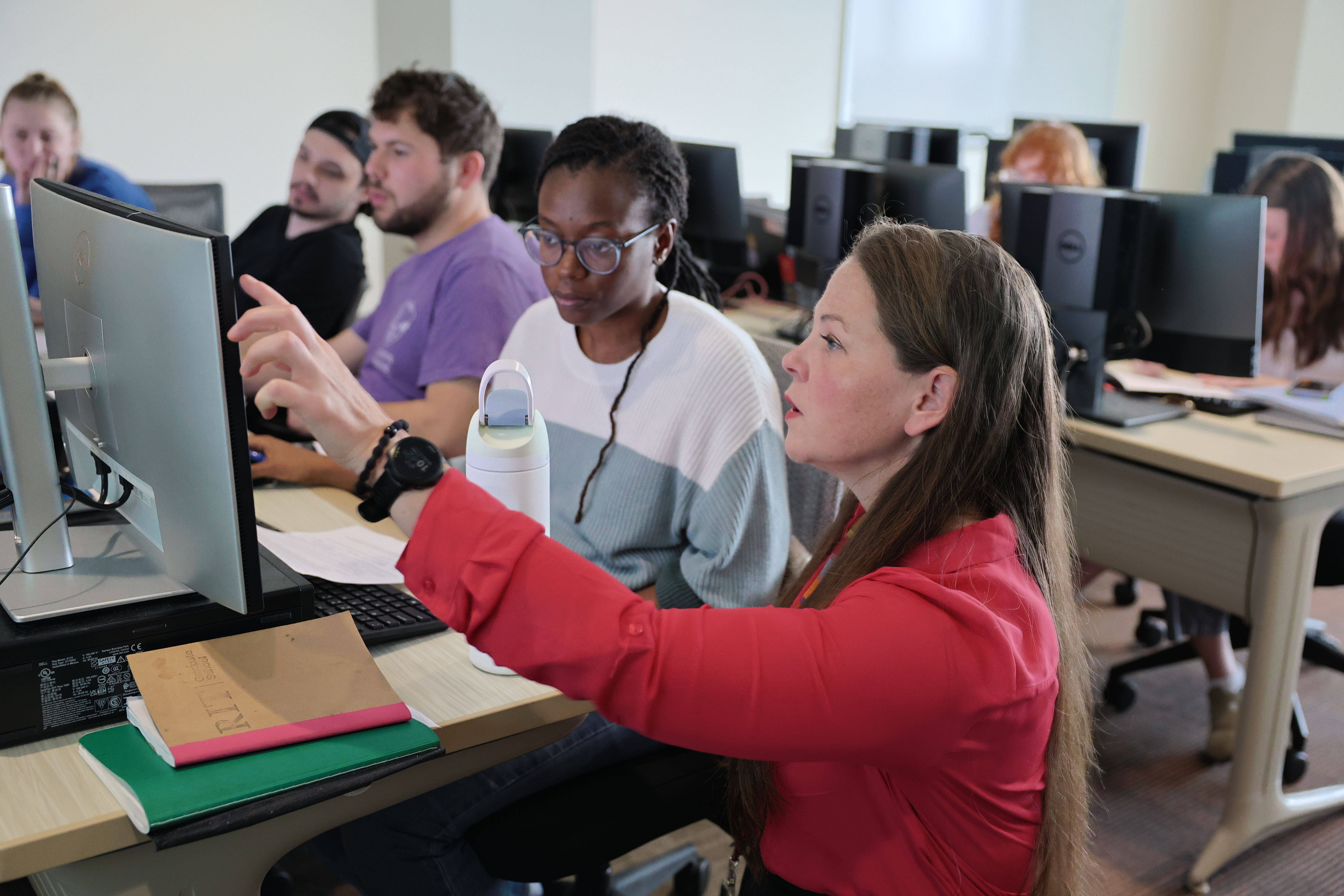 Professor Callie Babbitt working with students