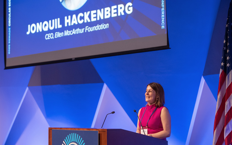 Jonquil Hackenberg speaking at a podium at the REMADE conference