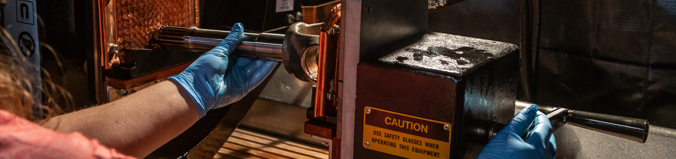 Engineer conducting magnetic particle inspection