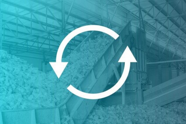 waste processing plant with blue overlay and two arrows forming a circle.