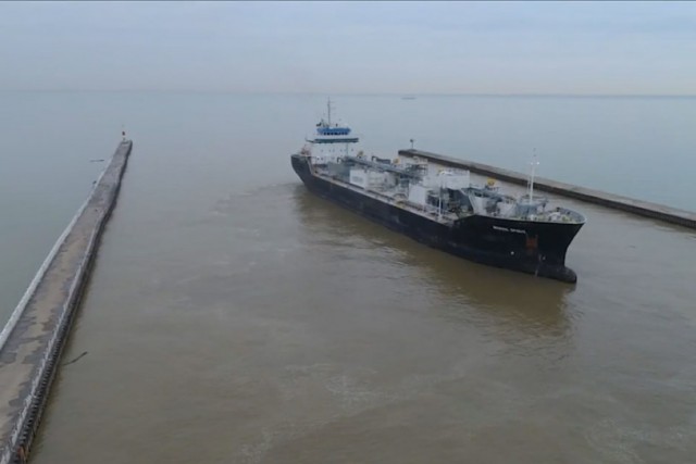 cargo ship leaving a port.