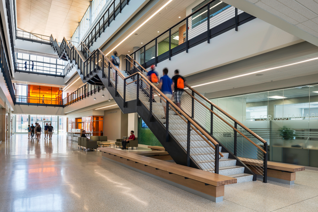 Students walking up stairs inside the GIS building