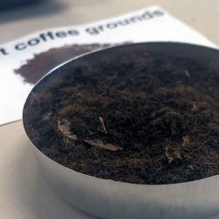 dish of spent coffee grounds.