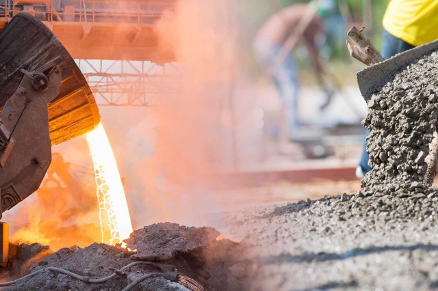 Molten steel is being poured on the left and concrete is being poured on the right. 