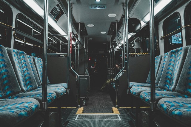 interior of a bus with a dark coloring.