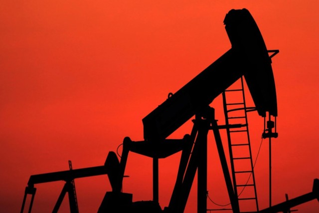 Oil pumpjack operating in a field, representing crude oil extraction tied to global energy markets.