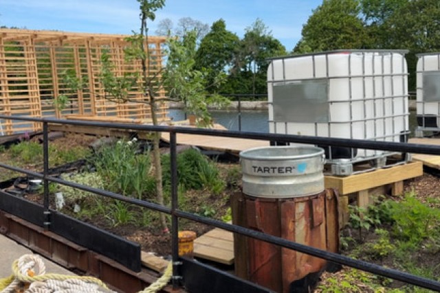 a view of a garden on the rooftop of a building
