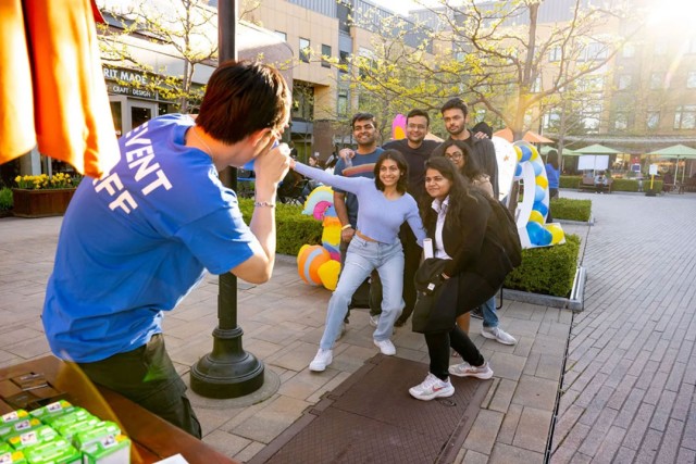 a group of students smile while getting their photo taken