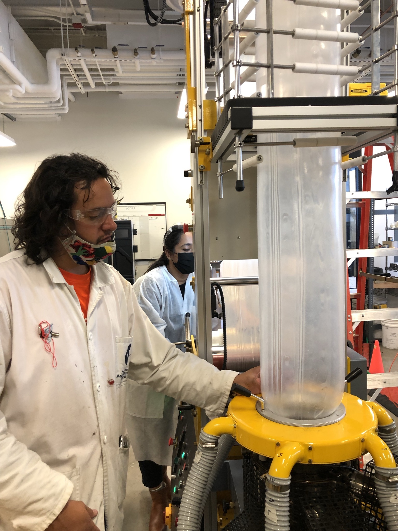 Researcher manufacturing plastic film