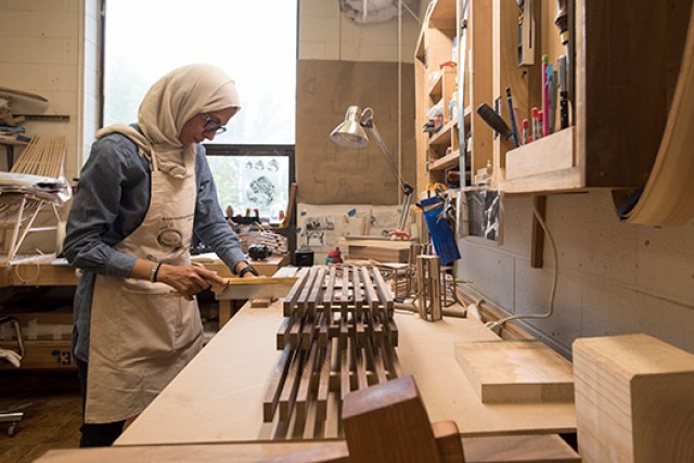 student working on woodworking project.