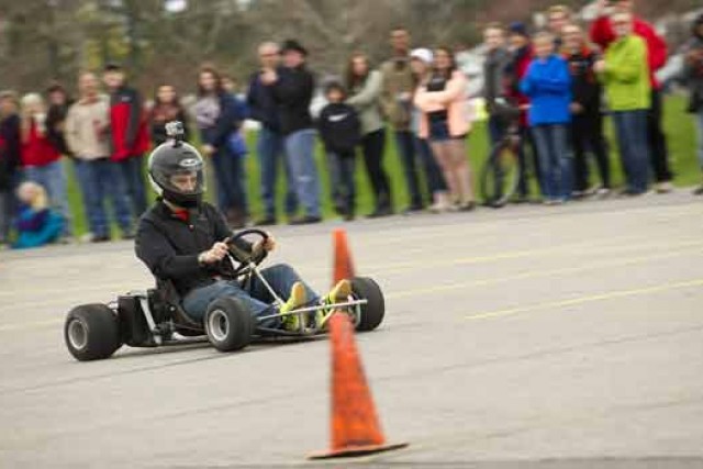 Person racing go kart