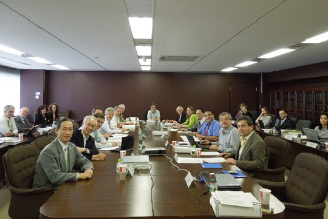 People gathered around table at meeting