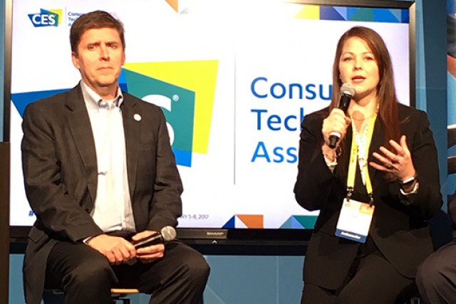 Two people talking on stage at event