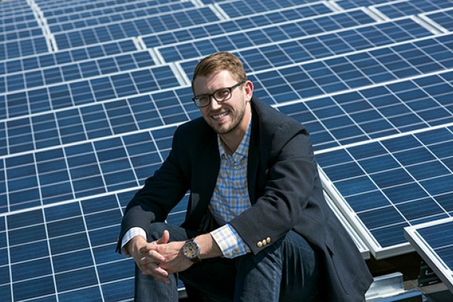 Mike Waller pictured in front of solar array.