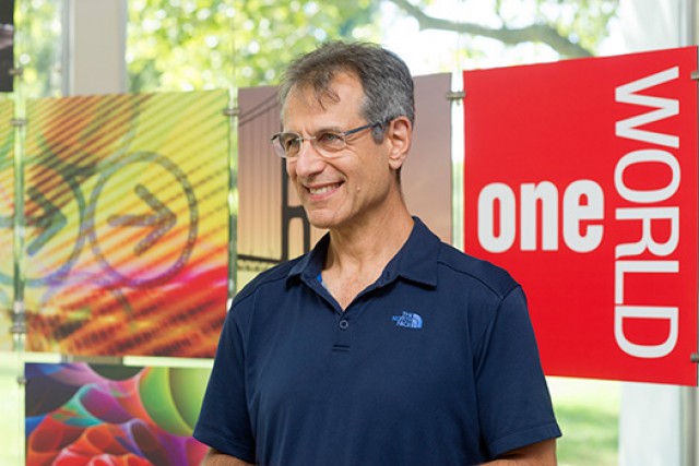 Person posing on stage during event