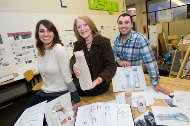 People posing with art