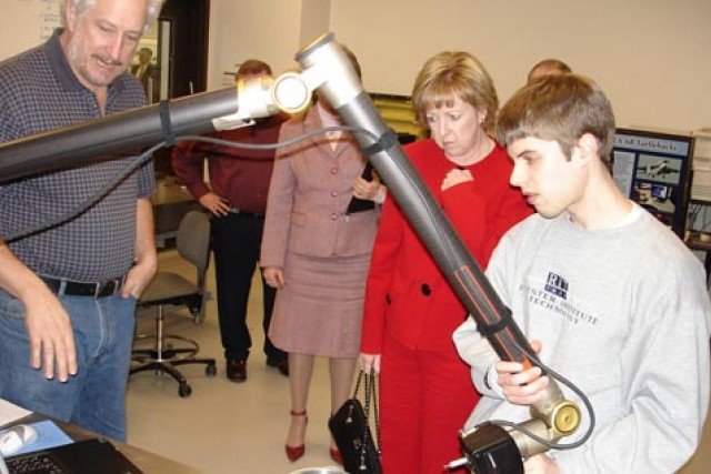 Student and Professor demonstrating a research project 