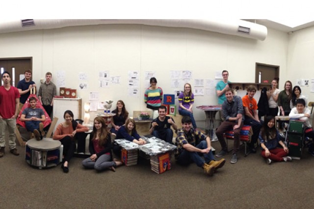People posing together in classroom