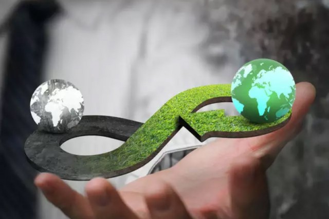 illustration of hand holding a figure-eight symbol with two globes on either end.