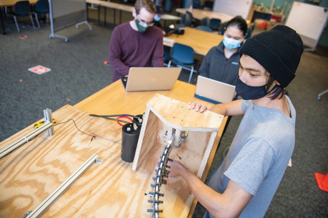 students working on robotic tail project.