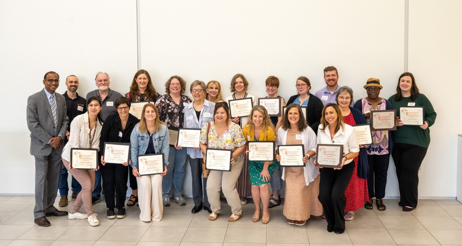 Group photo of 2025 Length of Service Honorees with their certificates