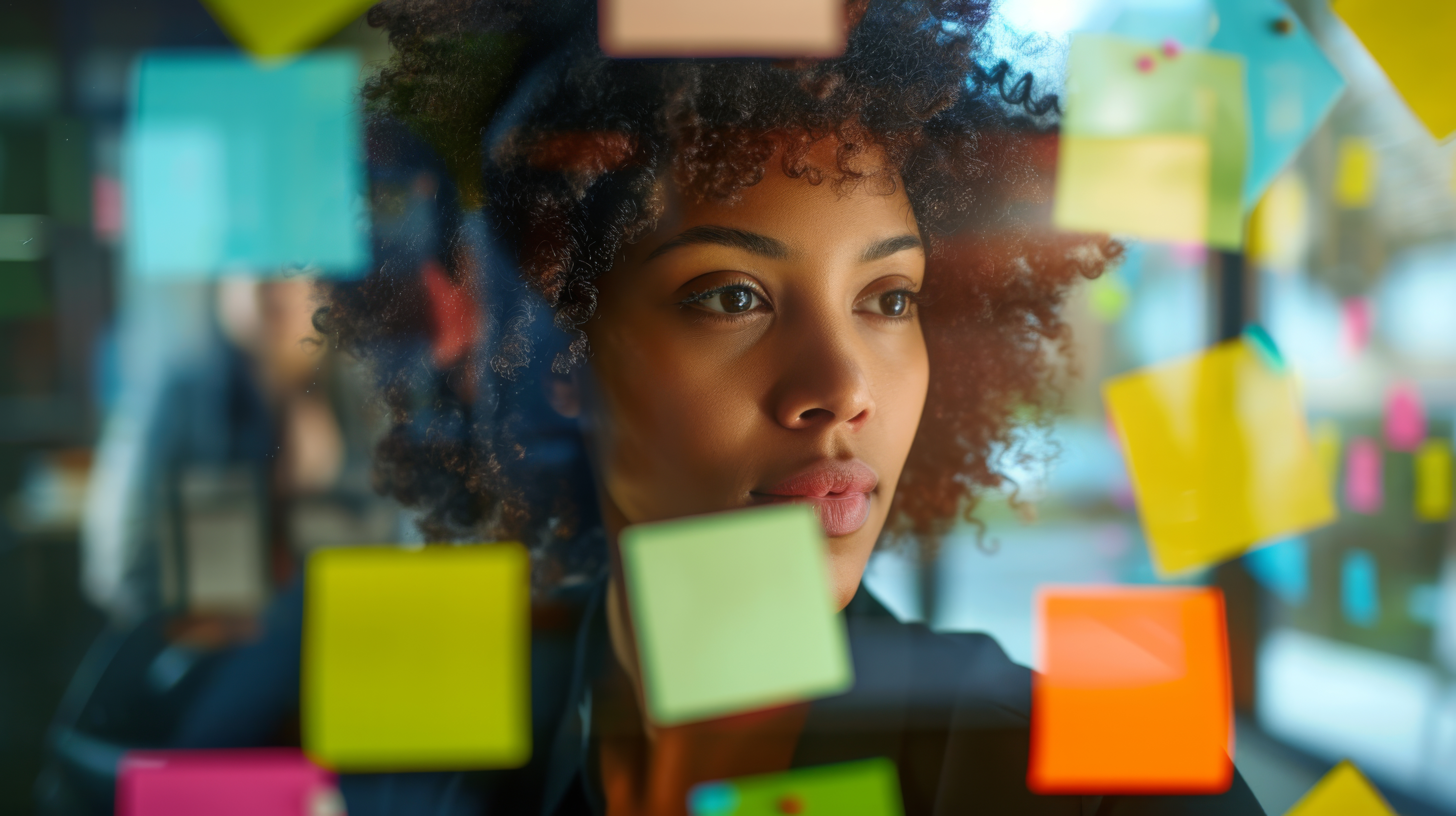 black women in front of whiteboard with post it notes