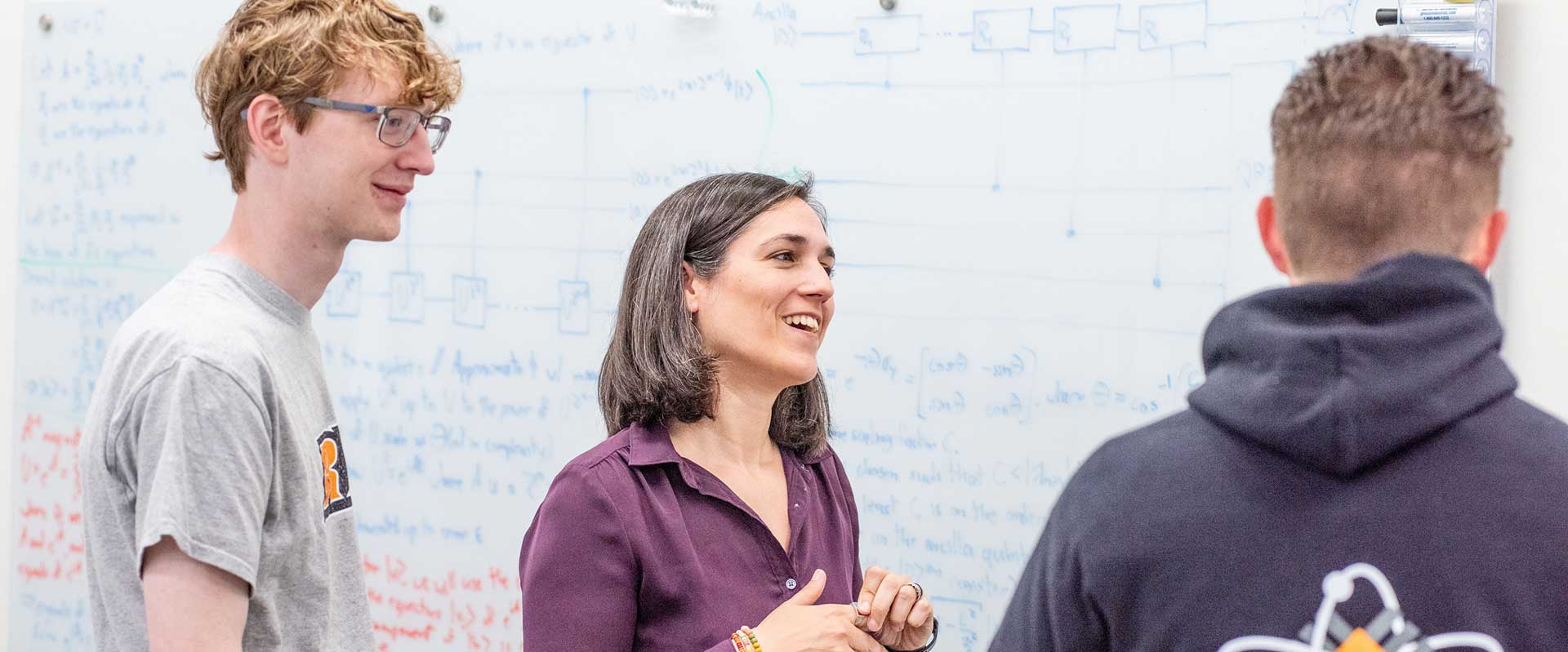 Instructor speaking with students