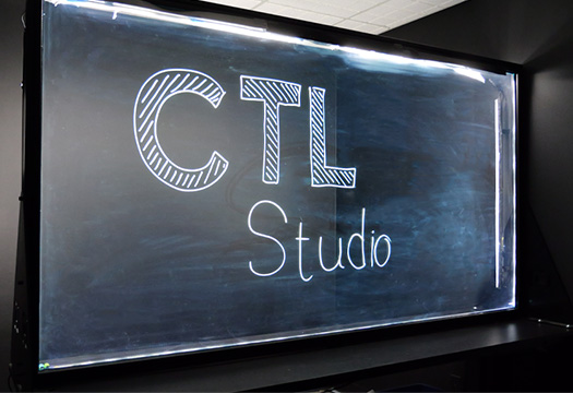 image of a lightboard set against a dark studio background with the words CTL Studio written on the glass