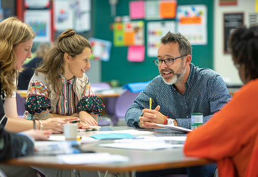 teachers collaborating in a faculty meeting