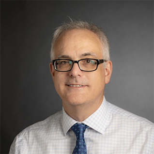 headshot of Garret Arcoraci