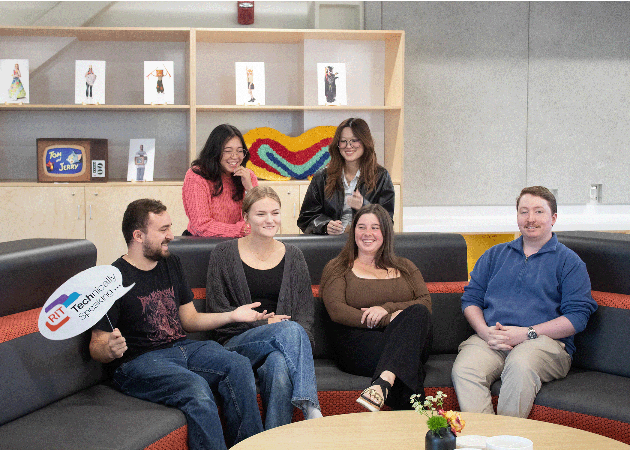 Technically Speaking students sitting together laughing
