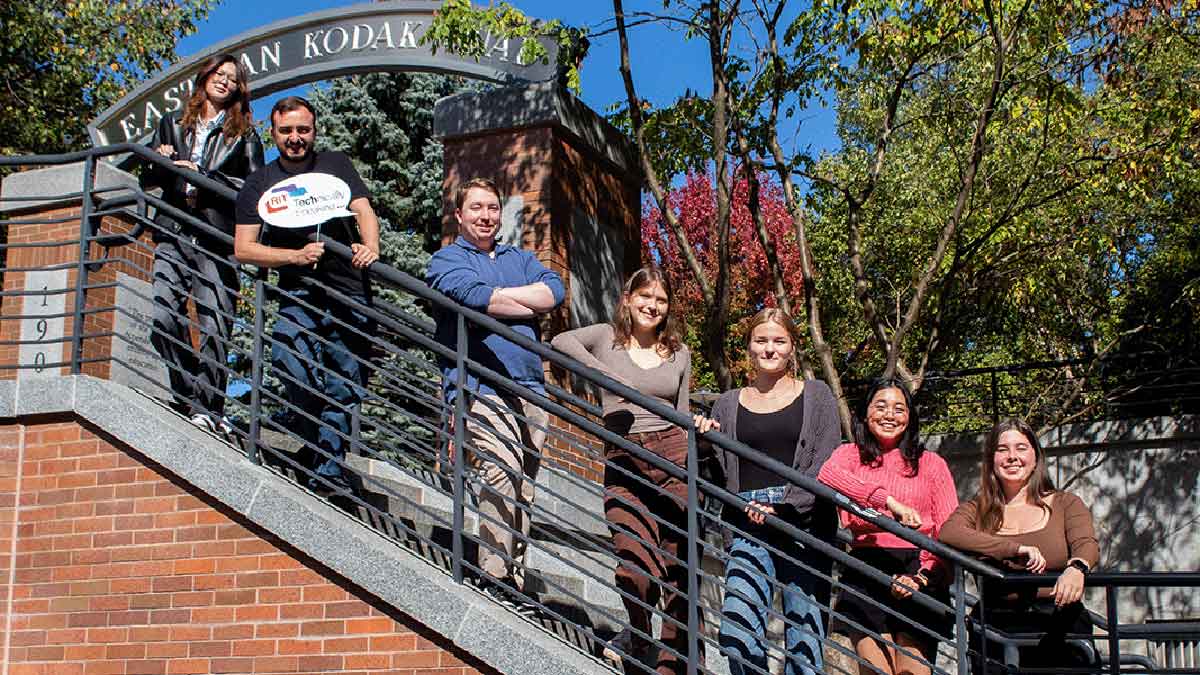 7 students standing along a stairwell