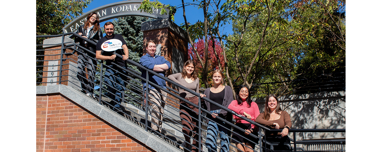 7 students standing along a stairwell