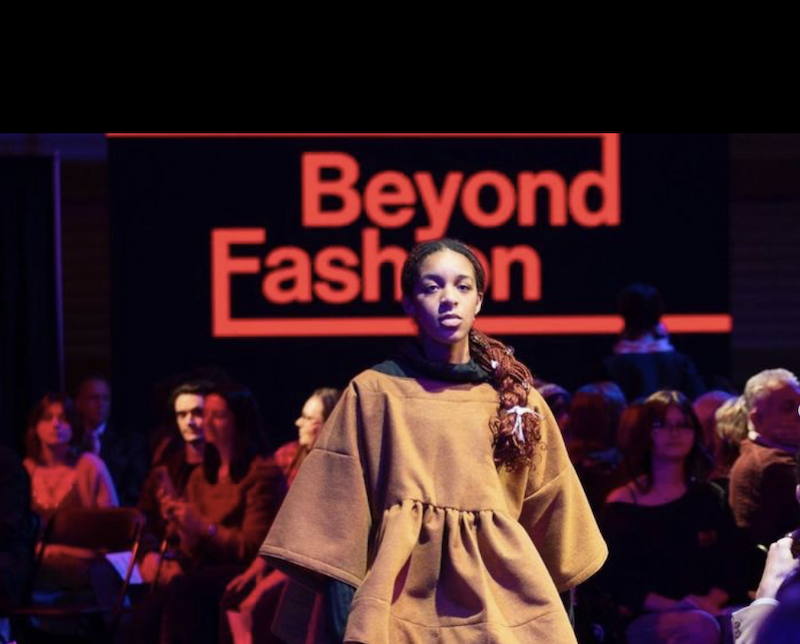 model standing in front of words 'Beyond Fashion'